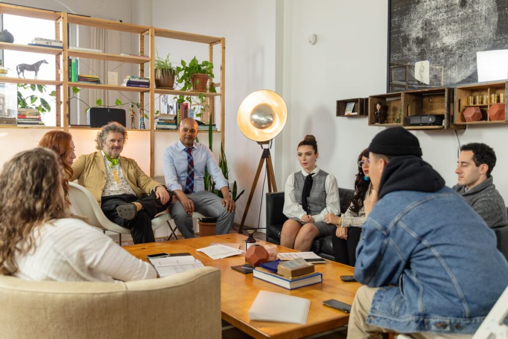 Agency staff reviewing workload and scheduling on a board in a modern office