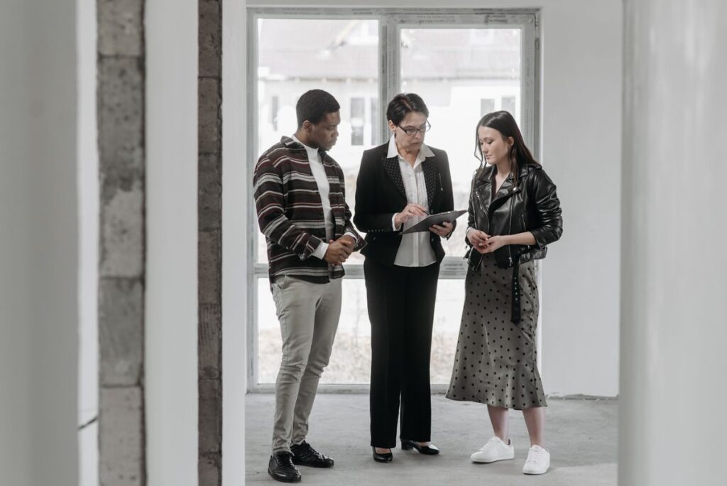 Property professional reviewing listing details with prospective buyers