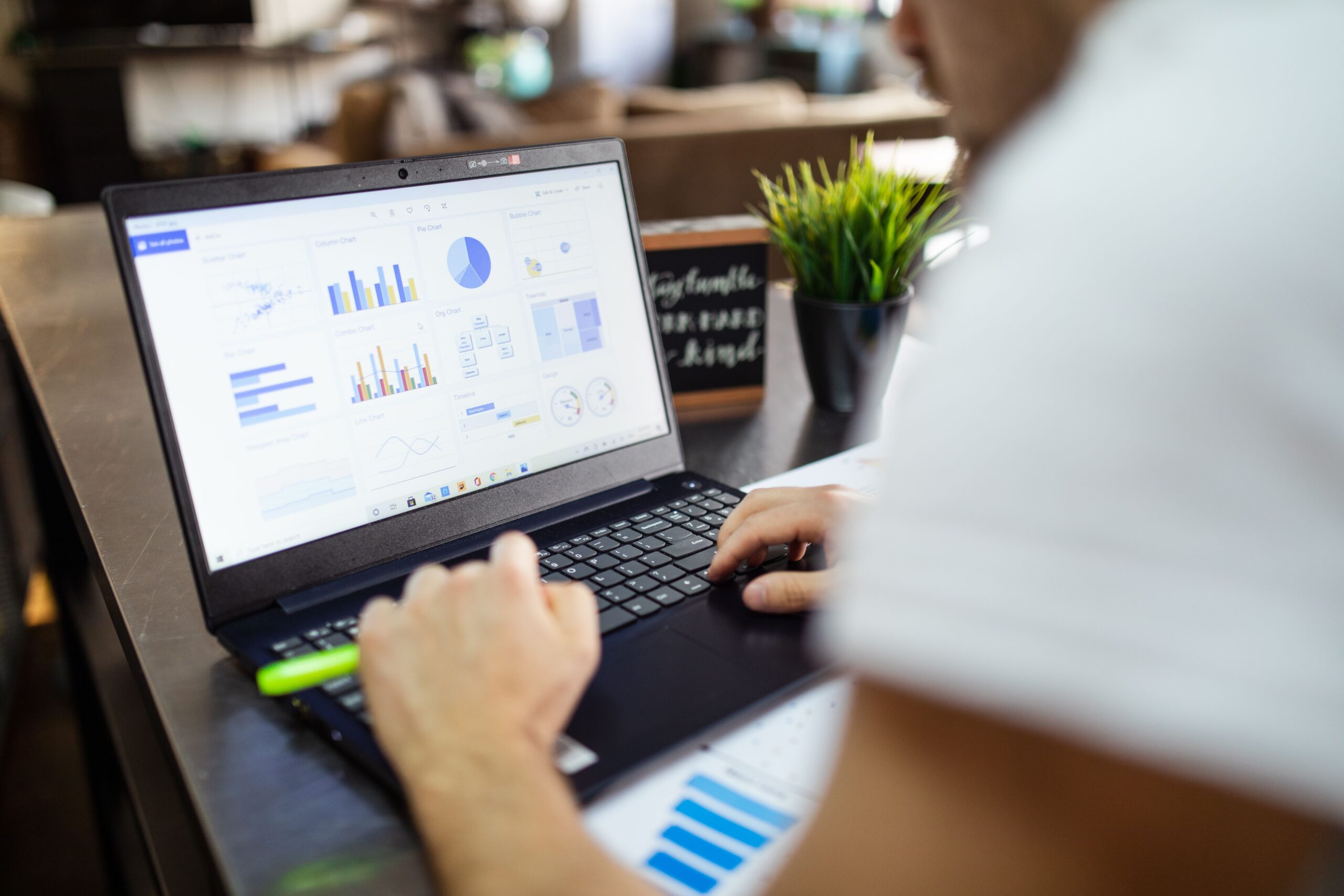 Sales trend charts and product research data displayed on a laptop