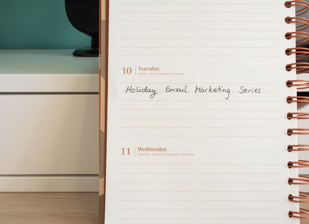 Desk planner showing an email marketing automation strategy mapped out by hand