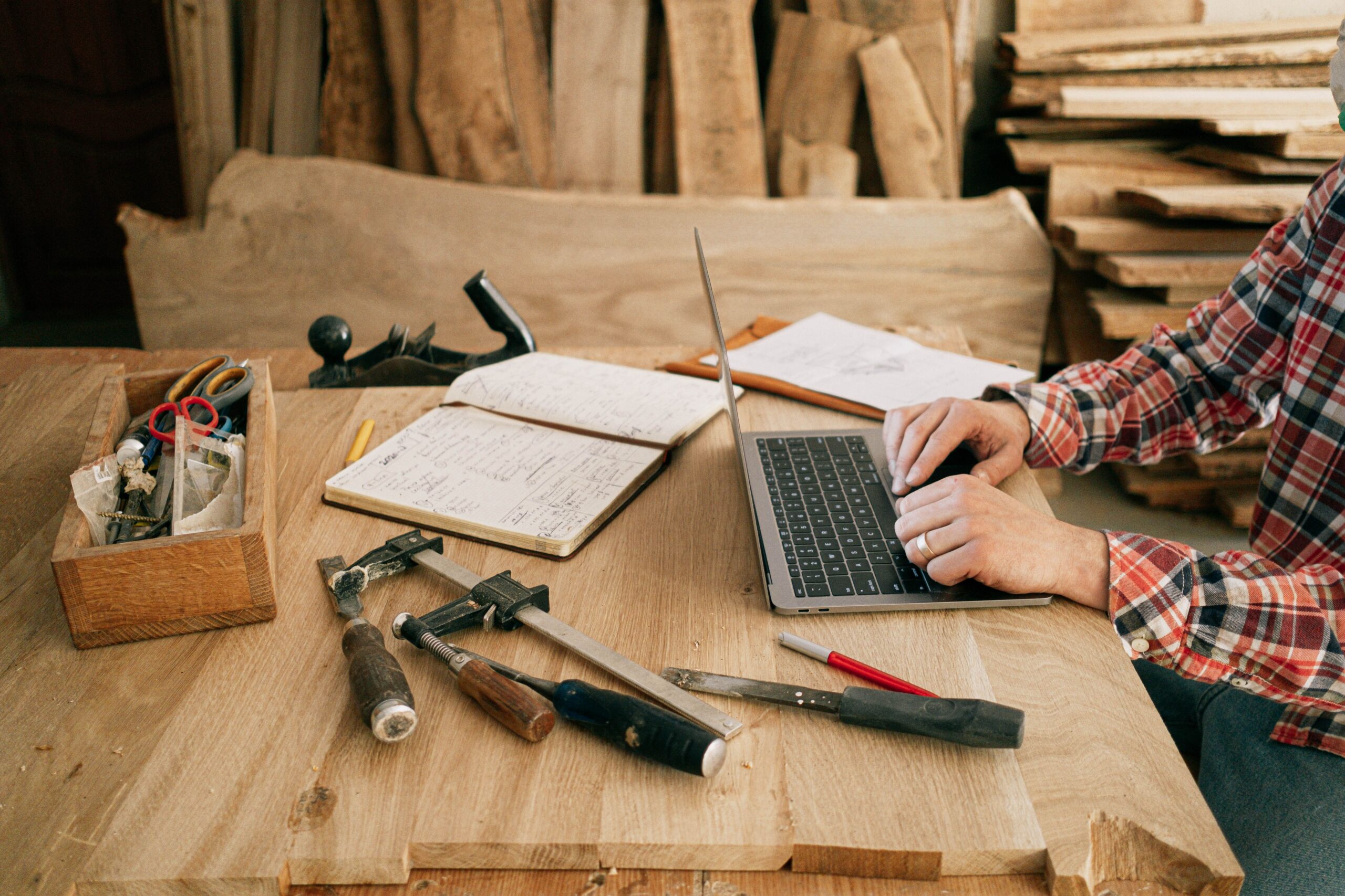 Maker reviewing marketplace commission and advertising charges on a laptop