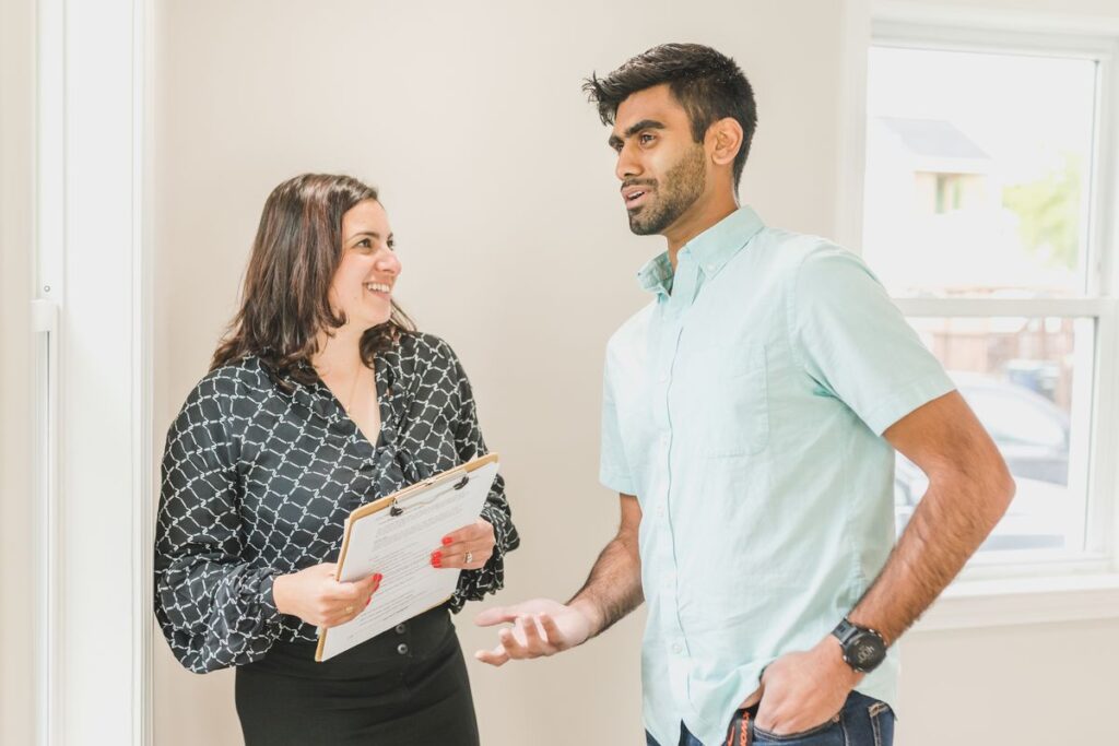 Estate agent speaking with a client about a property enquiry