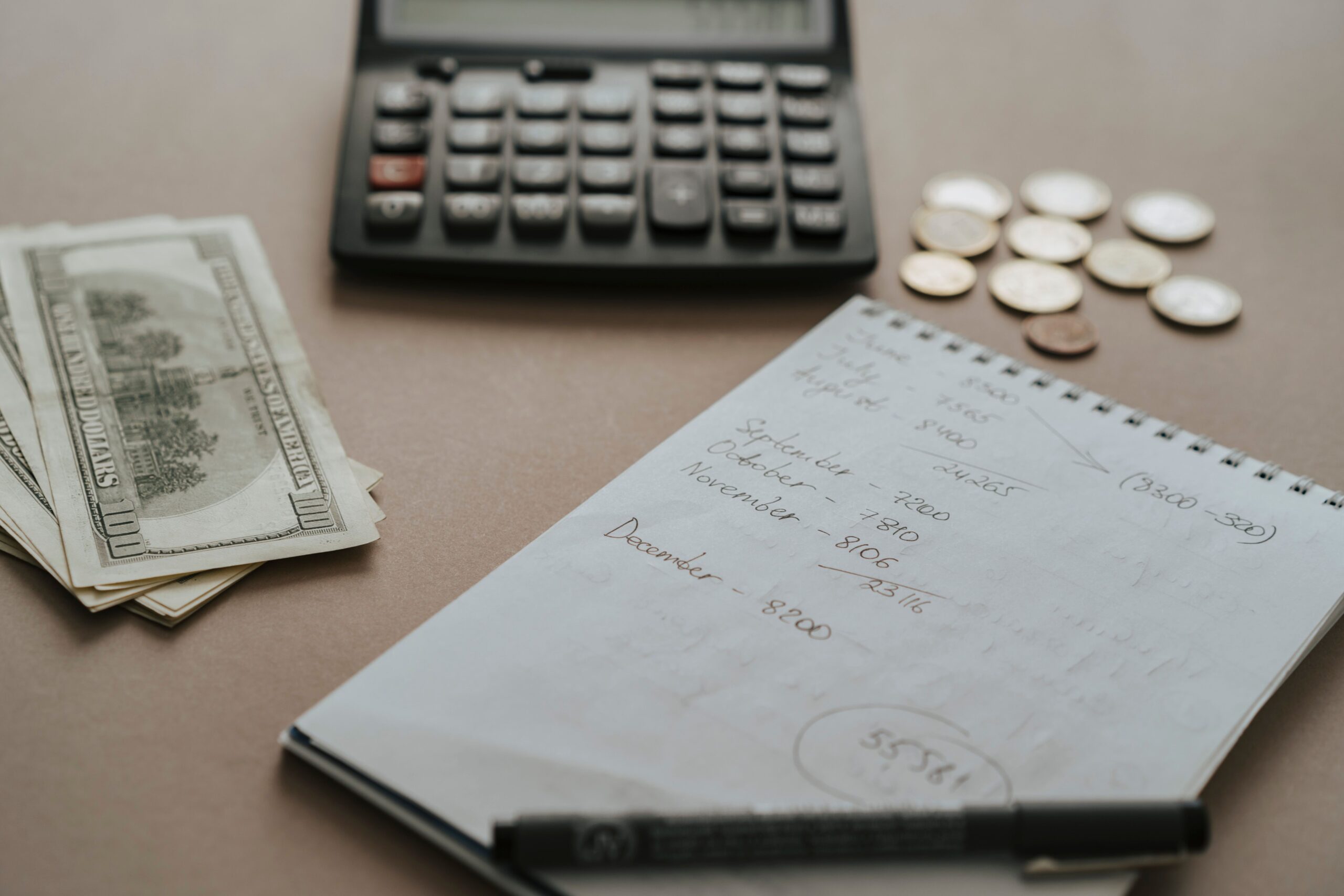 Calculator and notes used to break an agency quote down into hours and rates