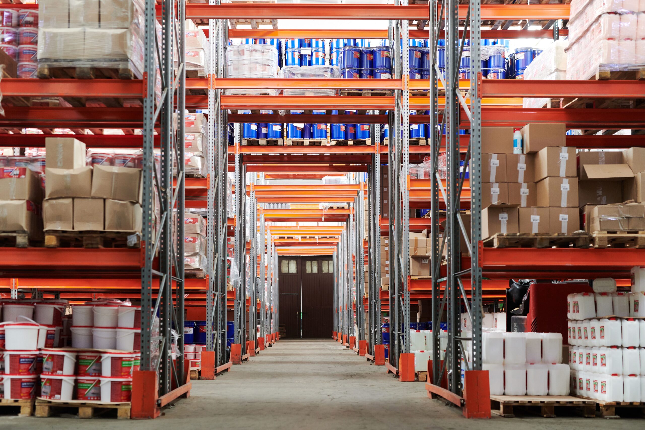 Warehouse aisle holding seasonal inventory ahead of a demand peak