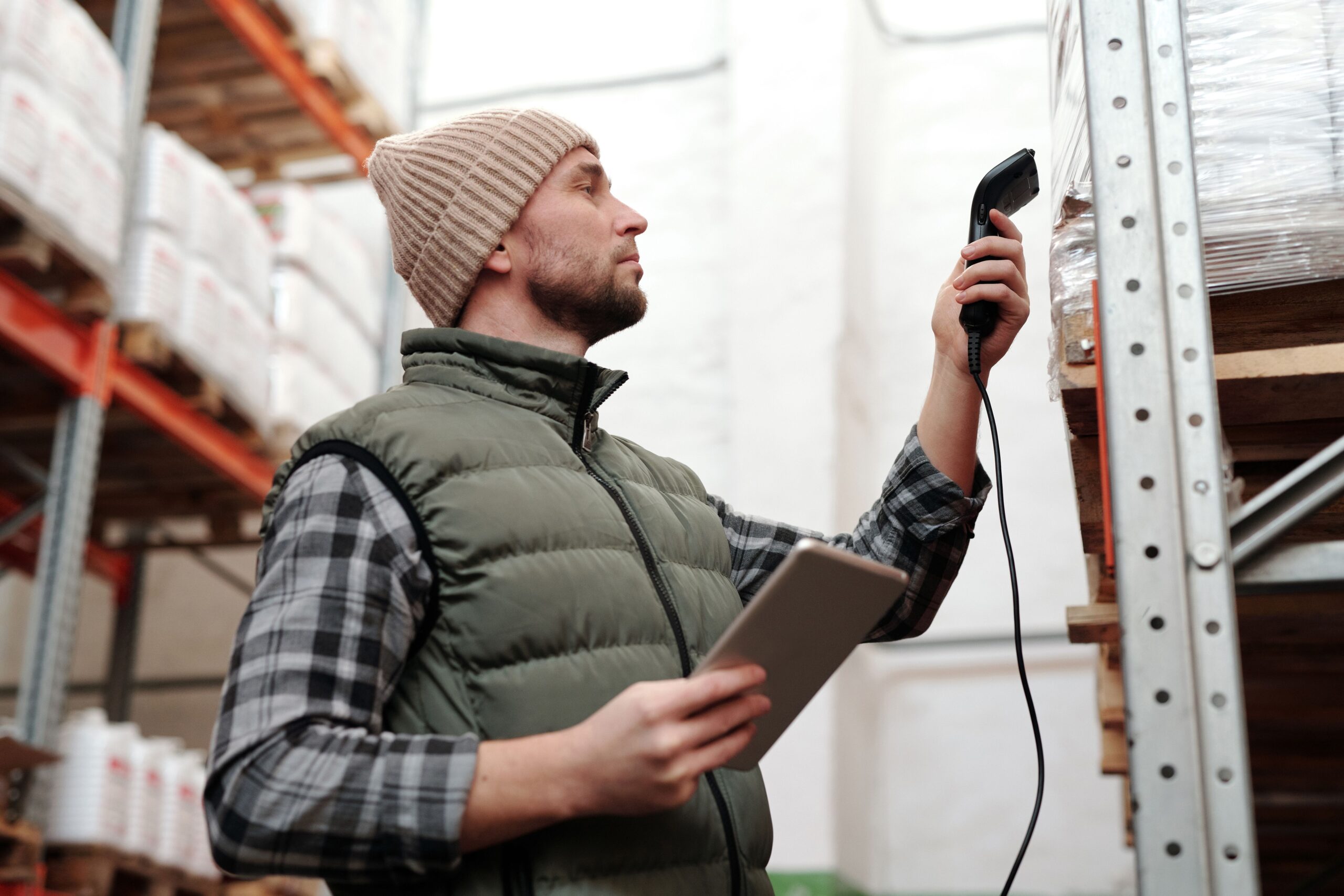 Warehouse worker scanning outbound orders before carrier collection