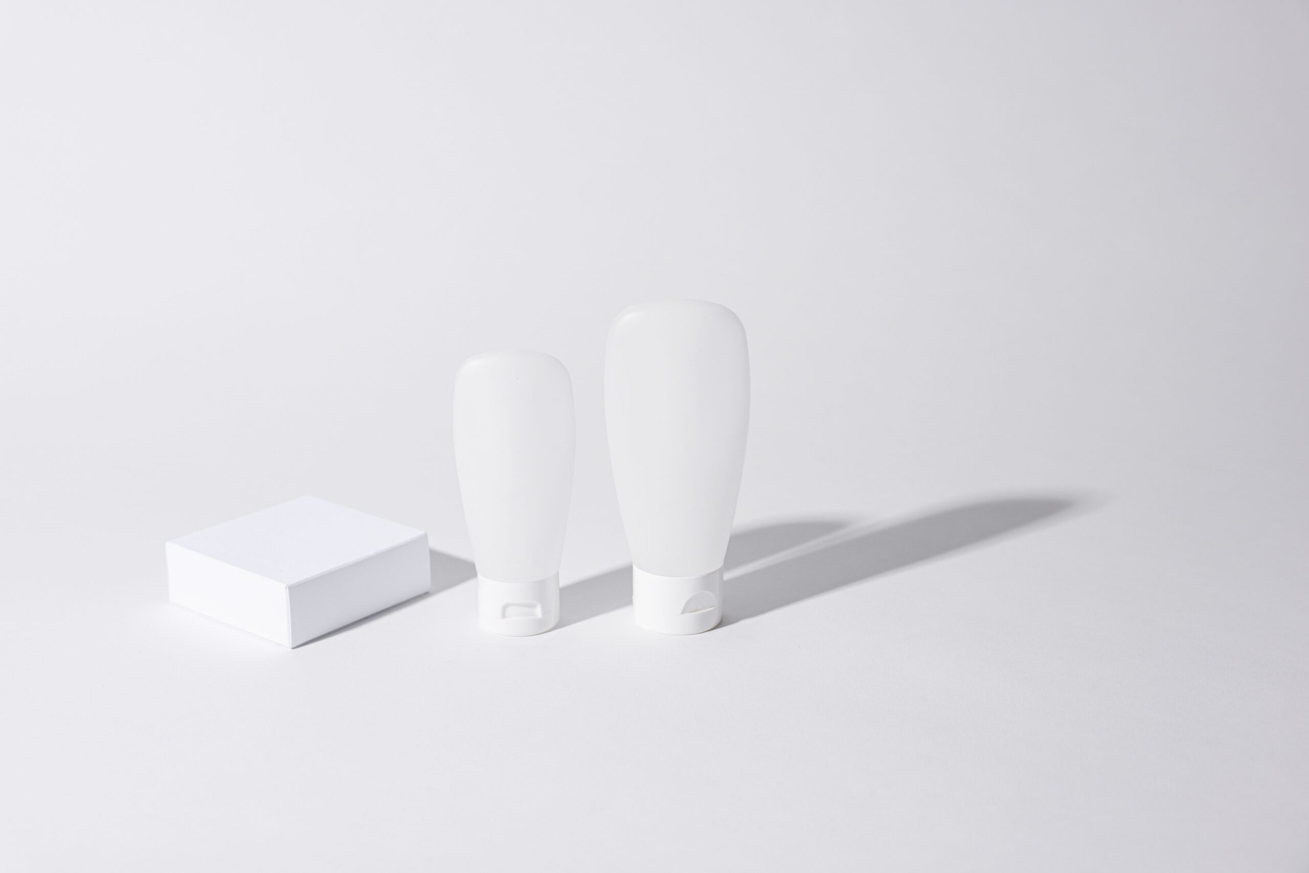 Product containers photographed on a pure white background