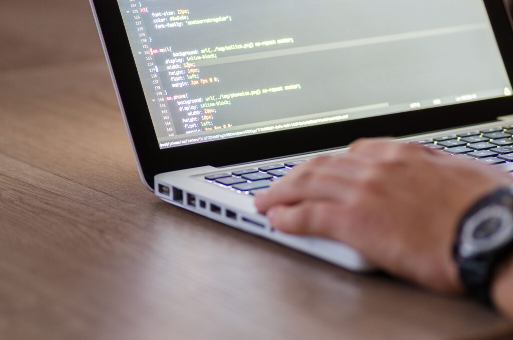 Developer writing Liquid template code for a bespoke storefront